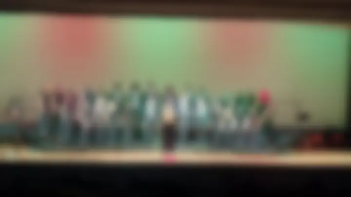 Wide, anonymized Chorus performance photograph